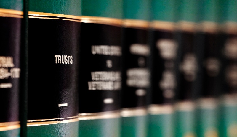 Books with Trusts on one of the spines by the Law Offices of Robert E. O’Connor